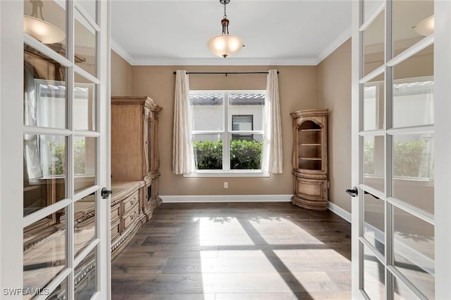 interior space featuring dark hardwood / wood-style flooring, crown molding, and french doors