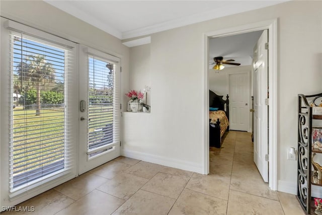 doorway to outside featuring light tile patterned flooring, ceiling fan, crown molding, and french doors