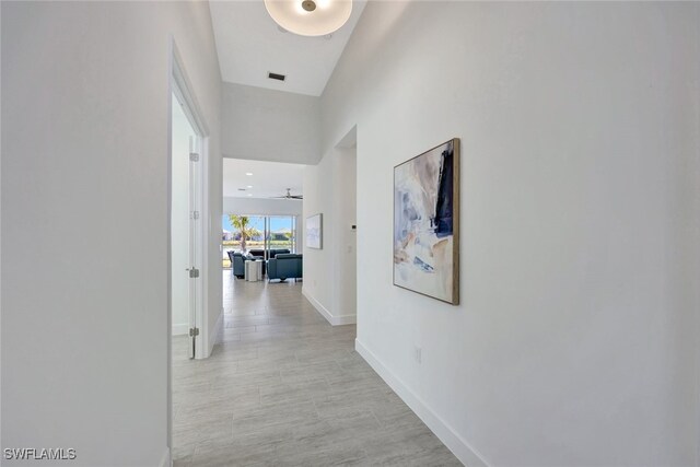 12418 Dahlia Ct, Naples, FL 34120 - hallway featuring baseboards