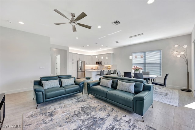 living room with ceiling fan