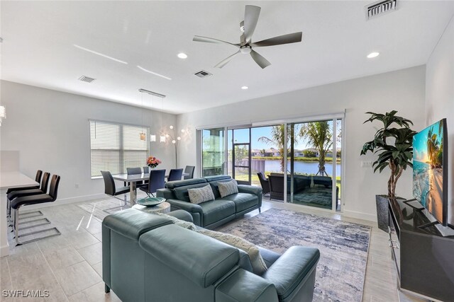 12418 Dahlia Ct, Naples, FL 34120 - living room featuring ceiling fan, baseboards, and recessed lighting