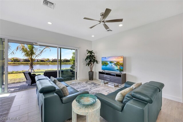 12418 Dahlia Ct, Naples, FL 34120 - living area featuring healthy amount of natural light, ceiling fan, recessed lighting, baseboards, and wood finished floors