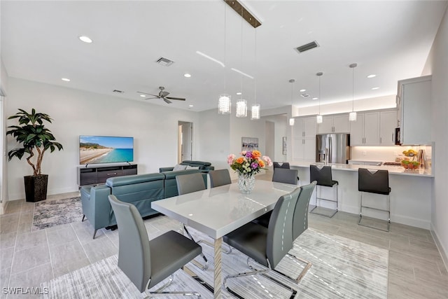 dining space with ceiling fan