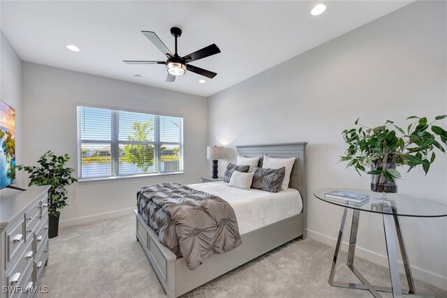 12418 Dahlia Ct, Naples, FL 34120 - bedroom with baseboards, light carpet, recessed lighting, and a ceiling fan