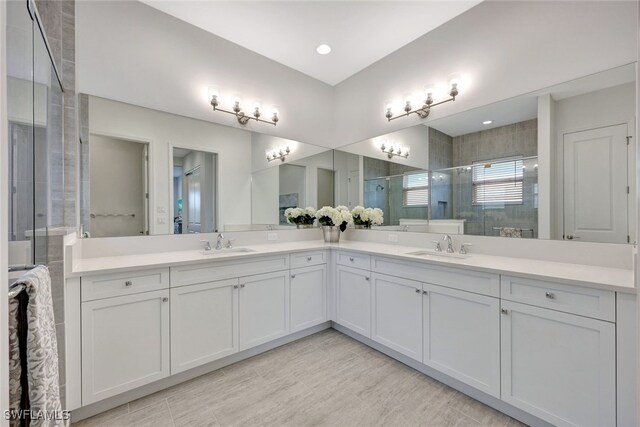 12418 Dahlia Ct, Naples, FL 34120 - bathroom with double vanity and a stall shower