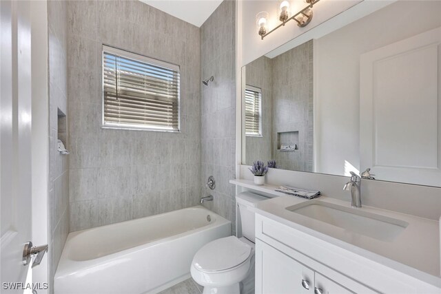 12418 Dahlia Ct, Naples, FL 34120 - full bathroom featuring vanity, shower / washtub combination, toilet, and healthy amount of natural light