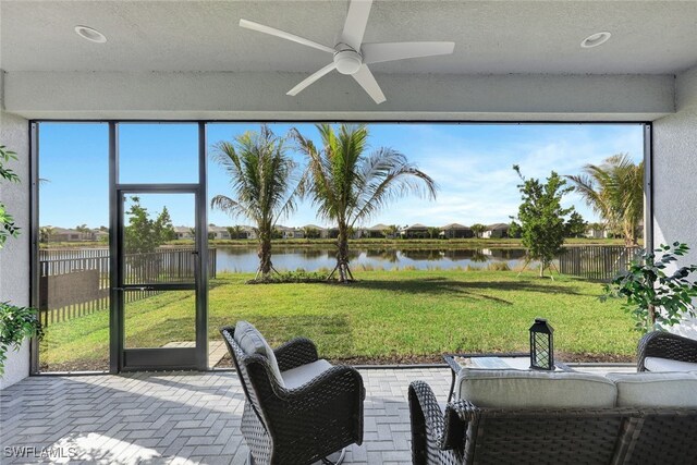 12418 Dahlia Ct, Naples, FL 34120 - sunroom featuring a water view and ceiling fan