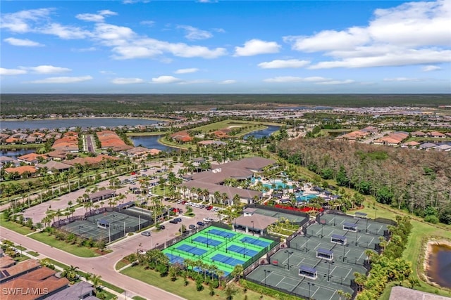 12418 Dahlia Ct, Naples, FL 34120 - aerial overview of property's location featuring a large body of water and nearby suburban area