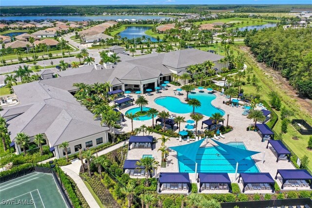 12418 Dahlia Ct, Naples, FL 34120 - aerial perspective of suburban area featuring a nearby body of water and a pool