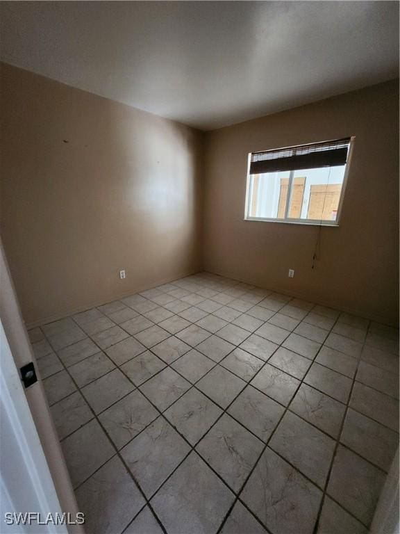 view of tiled spare room