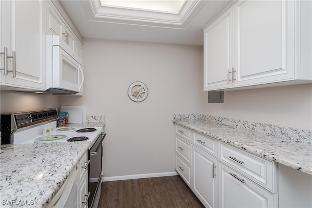 kitchen with light stone countertops, white cabinets, dark wood-type flooring, and white appliances