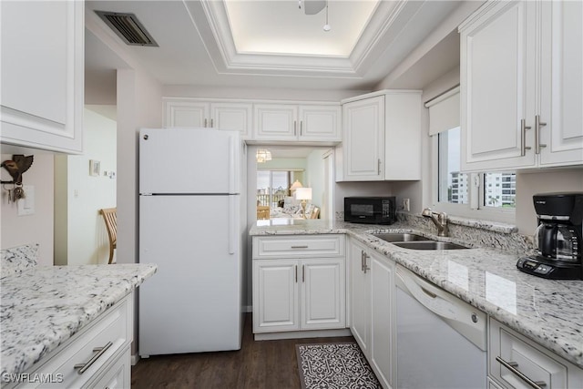 kitchen featuring white cabinets, white appliances, a wealth of natural light, and sink