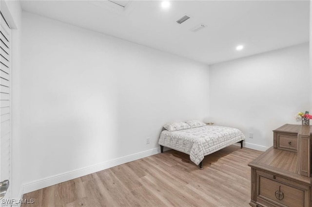 bedroom with light wood-type flooring