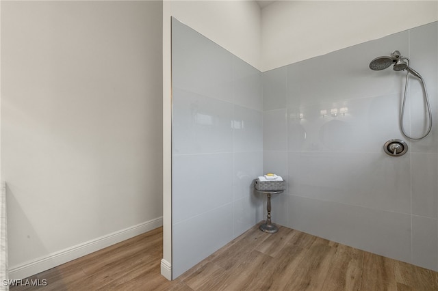 bathroom with walk in shower and wood-type flooring