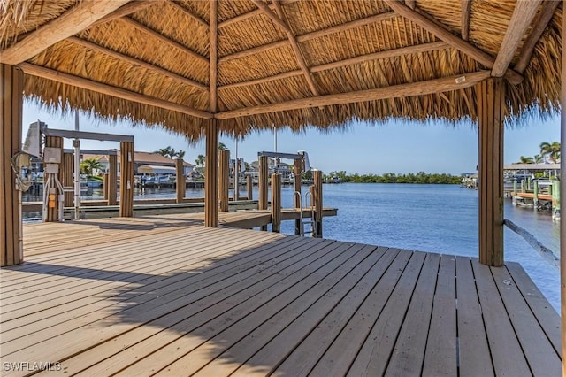 dock area with a gazebo and a water view