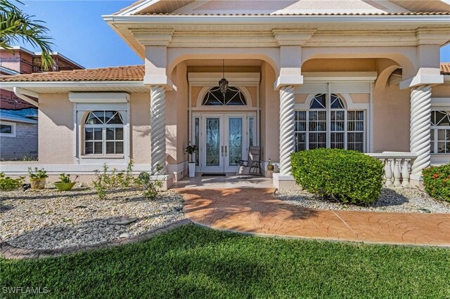 entrance to property featuring french doors