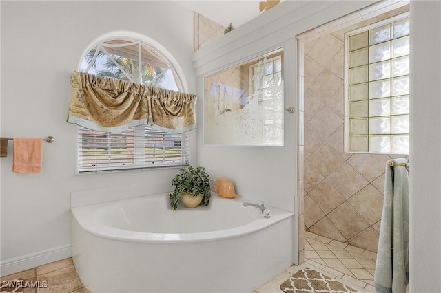 bathroom with tile patterned floors and a washtub