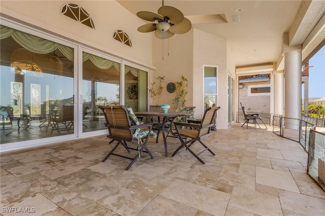 view of patio featuring ceiling fan