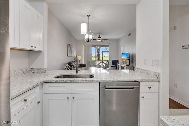 kitchen featuring sink, white cabinets, stainless steel dishwasher, and ceiling fan with notable chandelier