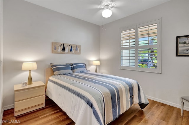 bedroom featuring hardwood / wood-style floors and ceiling fan