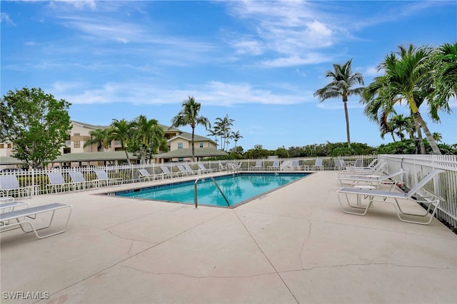 view of swimming pool with a patio area