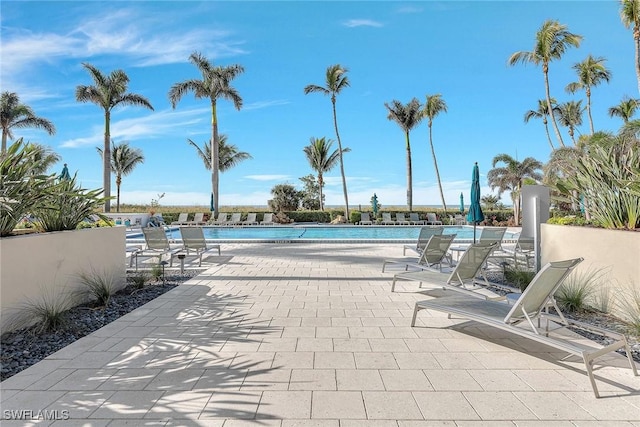 view of swimming pool featuring a patio area