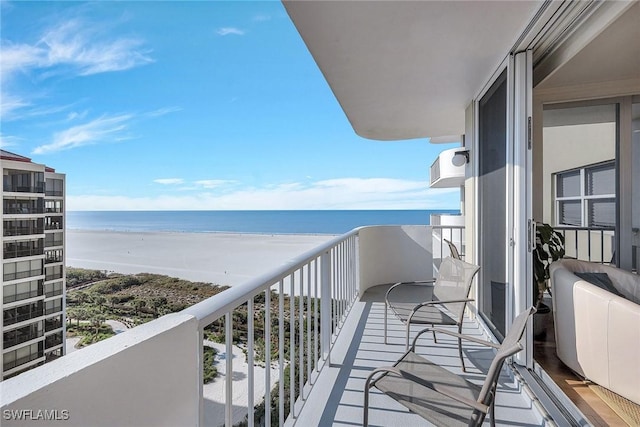 balcony with a view of the beach and a water view