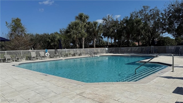 view of swimming pool featuring a patio