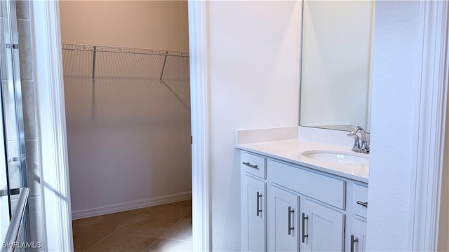 bathroom with tile patterned flooring and vanity