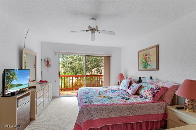 carpeted bedroom featuring a textured ceiling, access to outside, and ceiling fan