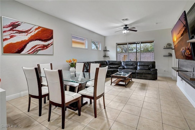 dining room featuring ceiling fan and light tile patterned floors