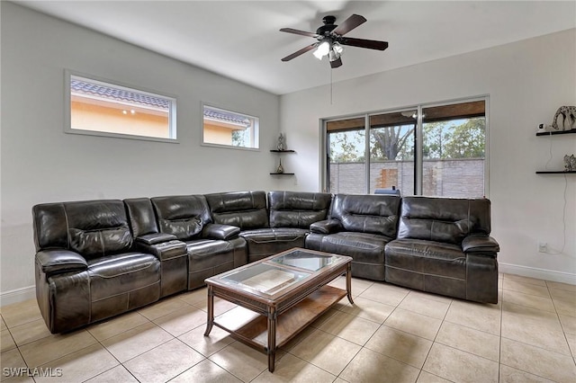 living room with ceiling fan and light tile patterned floors