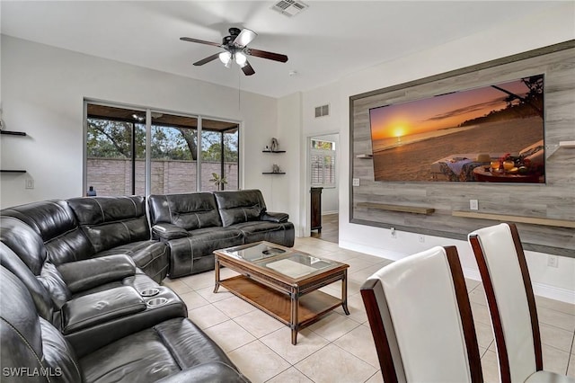 living room featuring ceiling fan and light tile patterned floors