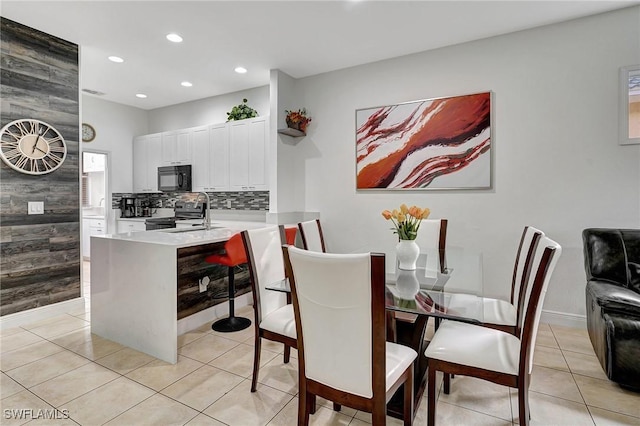 tiled dining room with sink