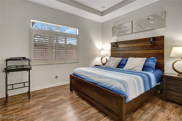 bedroom with hardwood / wood-style floors