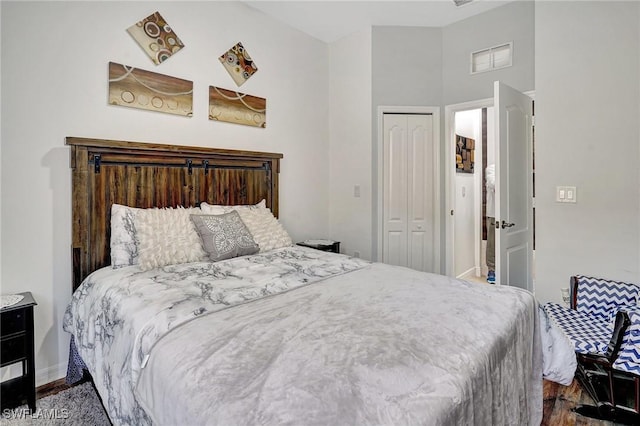 bedroom featuring a closet and hardwood / wood-style flooring