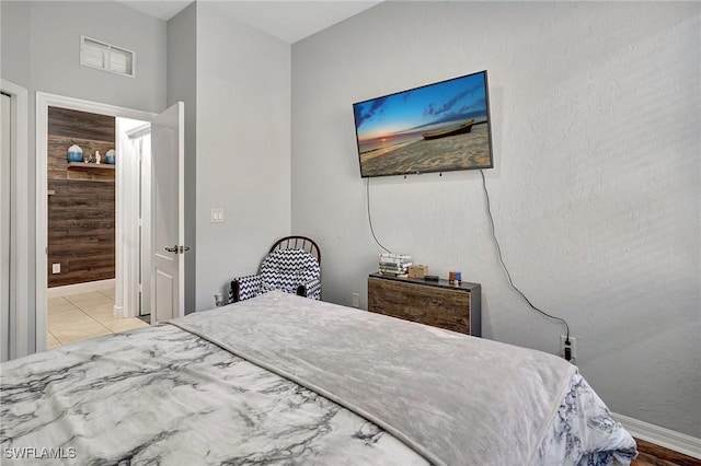 bedroom with light tile patterned flooring