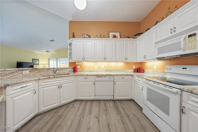 kitchen featuring white appliances, white cabinets, sink, ceiling fan, and light wood-type flooring