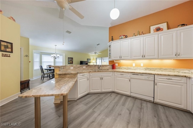 kitchen featuring dishwasher, kitchen peninsula, pendant lighting, lofted ceiling, and white cabinets