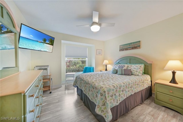 bedroom with light wood-type flooring and ceiling fan