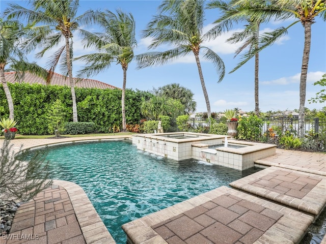 view of pool featuring an in ground hot tub