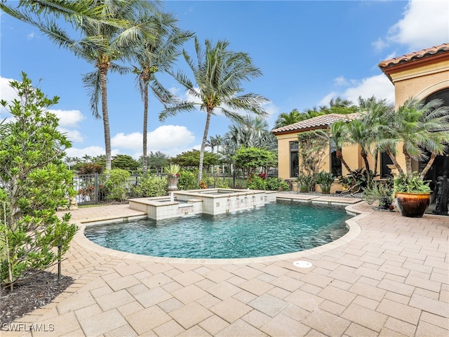 view of pool featuring an in ground hot tub and a patio area