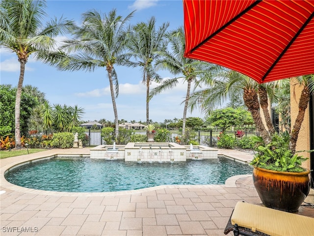 view of swimming pool with an outdoor hot tub and a patio area