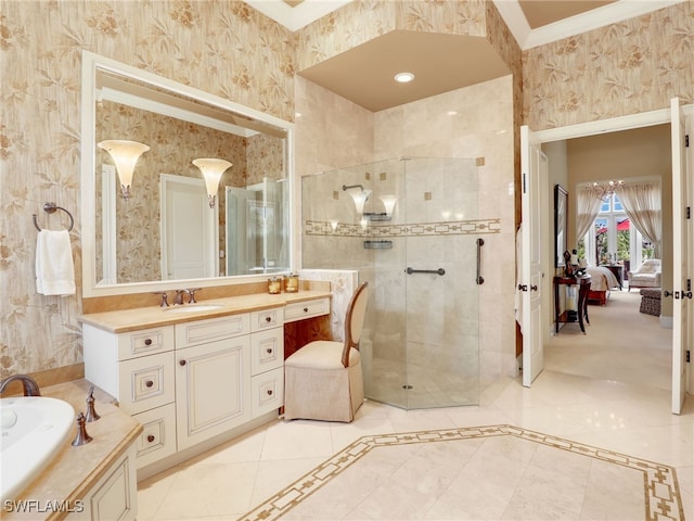 bathroom featuring ornamental molding, vanity, and a shower with shower door