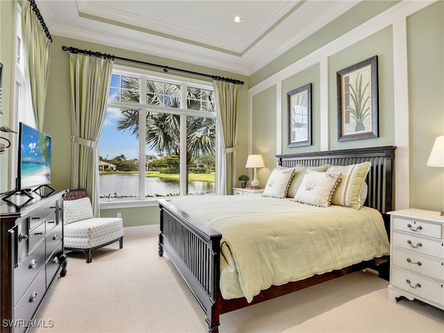 bedroom featuring a raised ceiling, ornamental molding, and light colored carpet