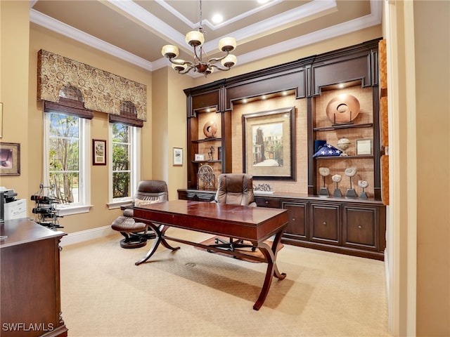 carpeted home office featuring crown molding, a raised ceiling, built in features, and a notable chandelier