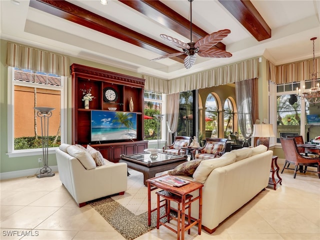 tiled living room with beam ceiling, a raised ceiling, and ceiling fan with notable chandelier