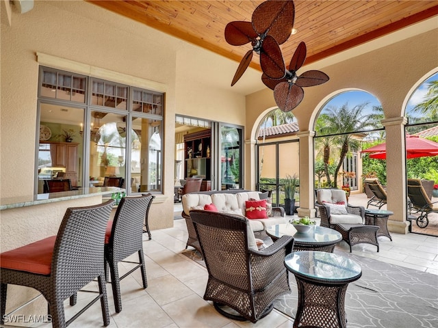 view of patio featuring an outdoor hangout area and ceiling fan