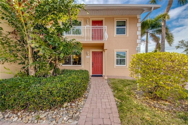 view of front of property with a balcony