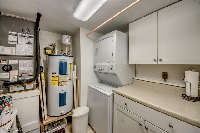 laundry room with stacked washer / dryer and water heater